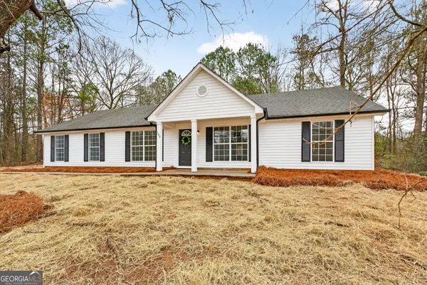 front view of a house and a yard