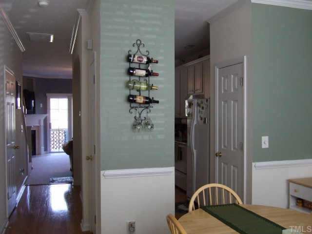 4806 Black Mountain Path Raleigh, NC 27612 - Photo 2 of 12 a view of a hallway with windows and chandelier