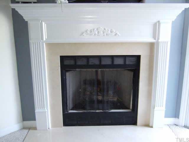 4806 Black Mountain Path Raleigh, NC 27612 - Photo 4 of 12 a fireplace with a hallway