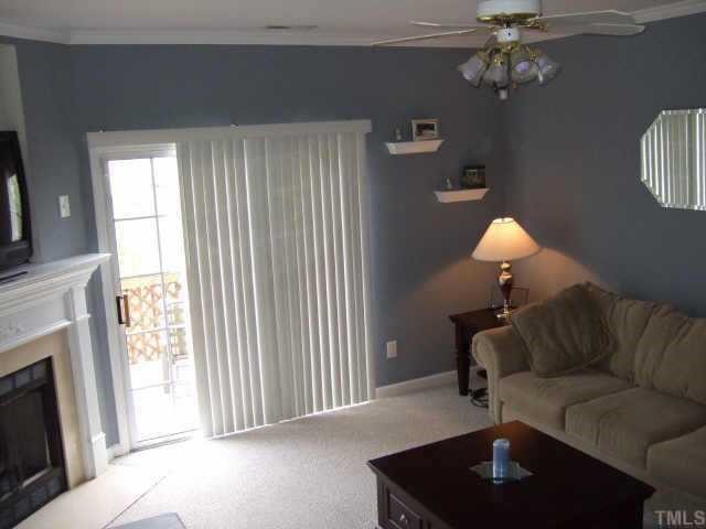 4806 Black Mountain Path Raleigh, NC 27612 - Photo 5 of 12 a living room with furniture and a fireplace