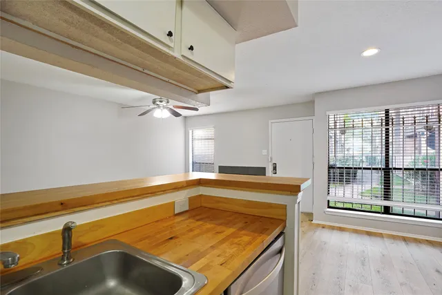 a view of a kitchen with a sink and dishwasher