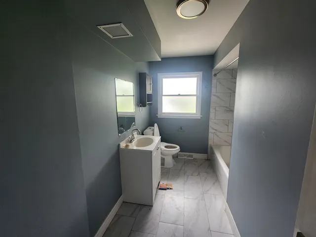 a view of a room and window in a room