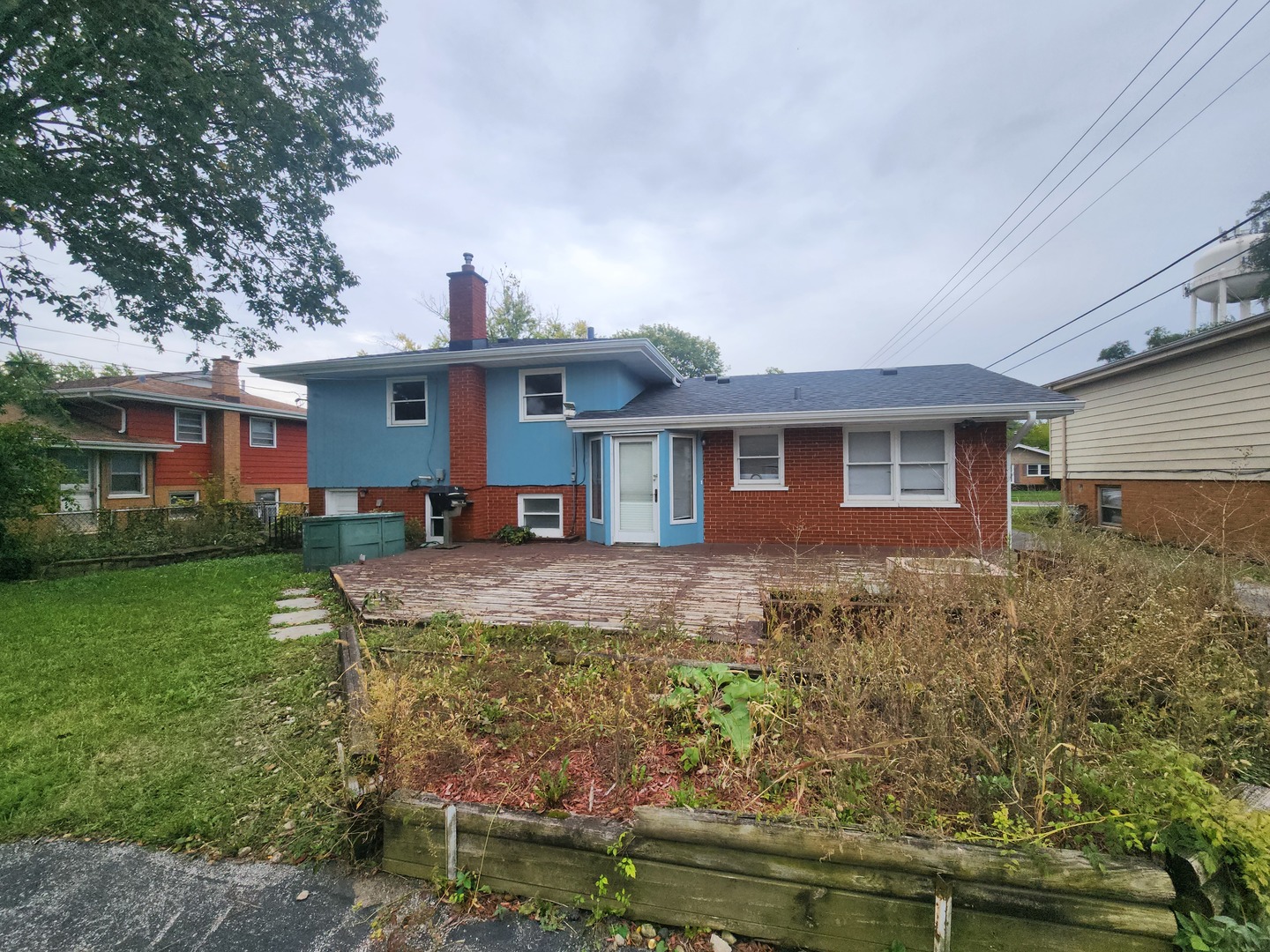 1208 Evergreen Road Homewood, IL 60430 - Photo 4 of 12 front view of a house with a yard