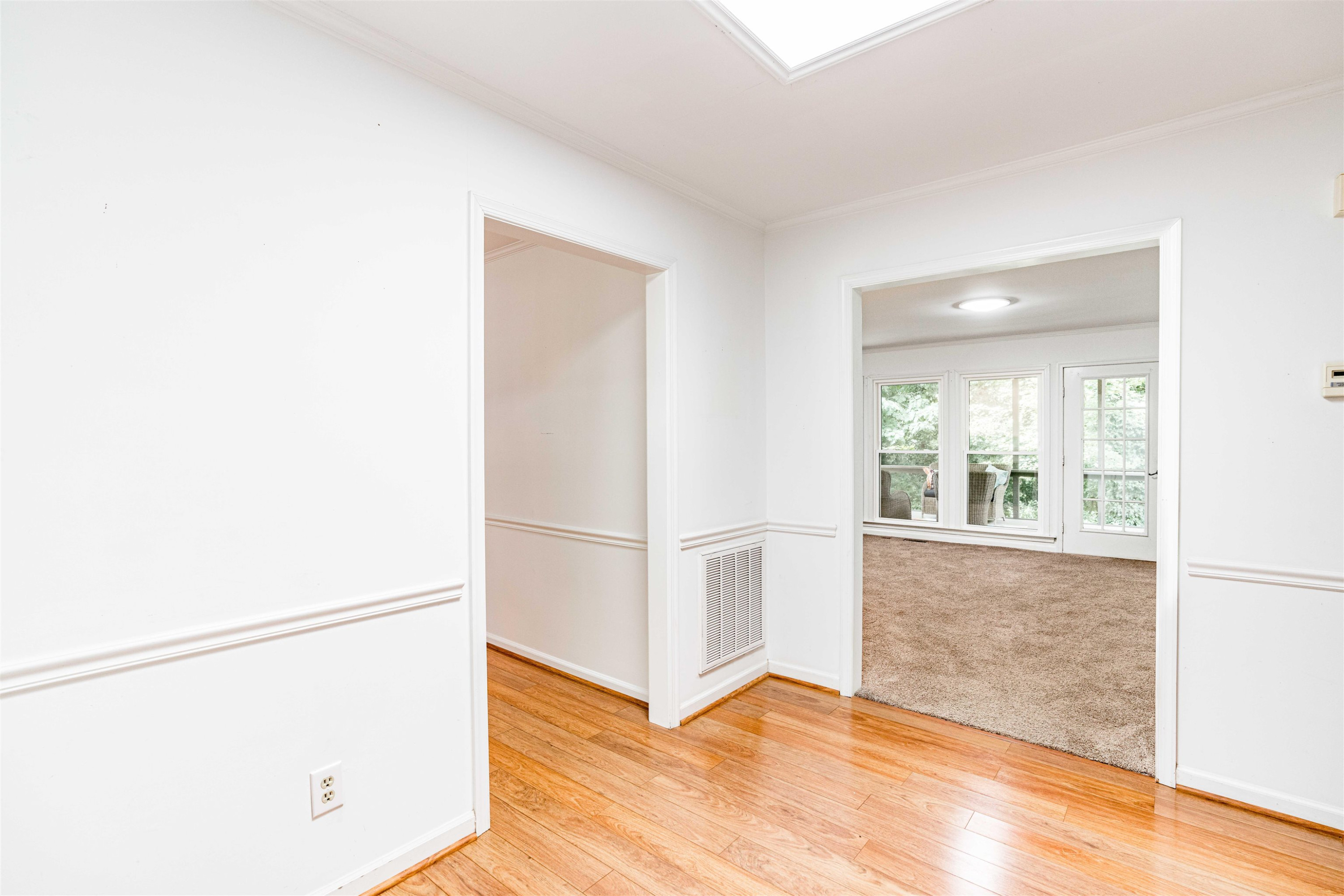 3013 Rue Sans Famille Raleigh, NC 27607 - Photo 3 of 16 a view of a livingroom with wooden floor