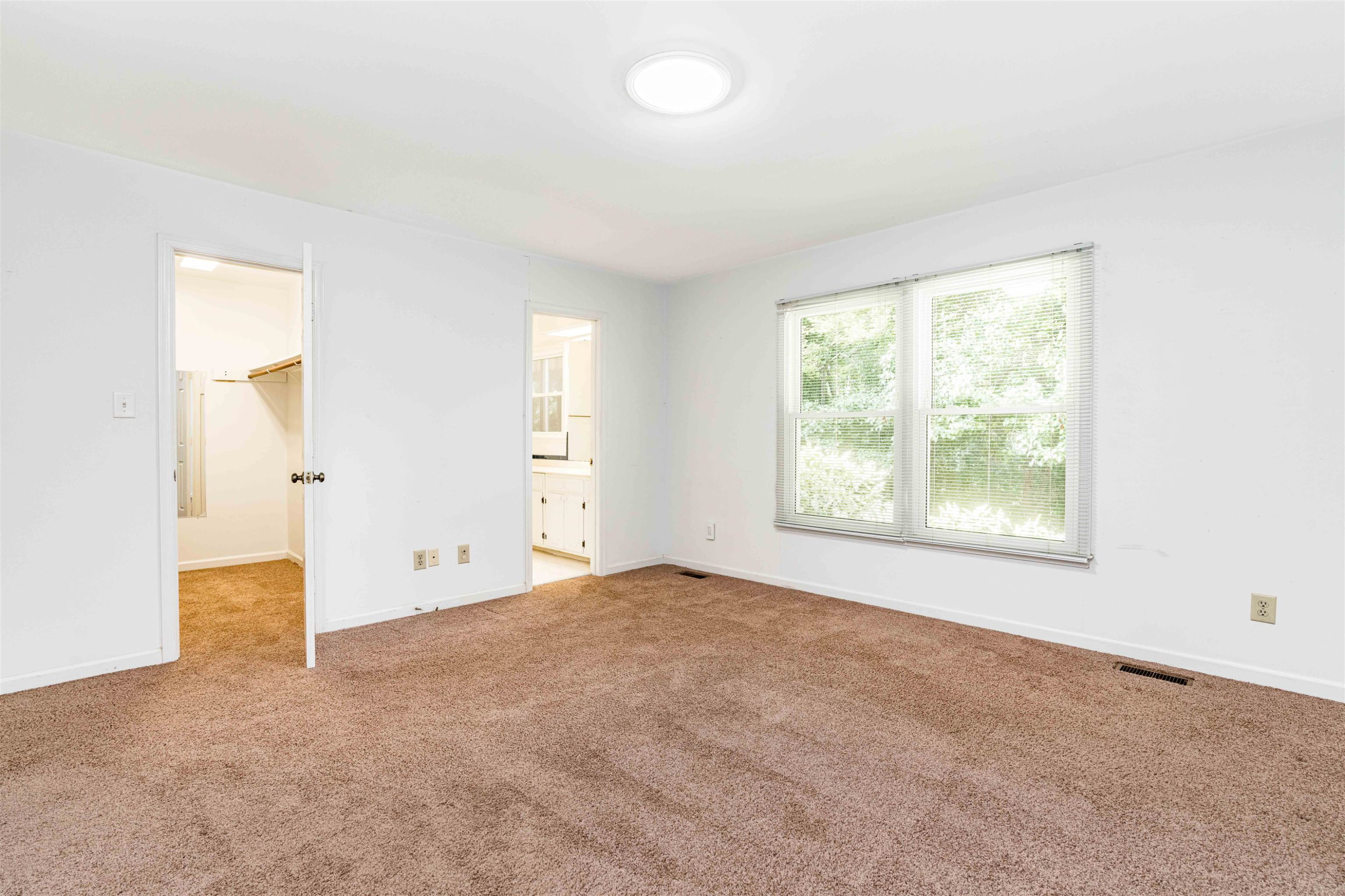 3013 Rue Sans Famille Raleigh, NC 27607 - Photo 10 of 16 an empty room with windows and closet