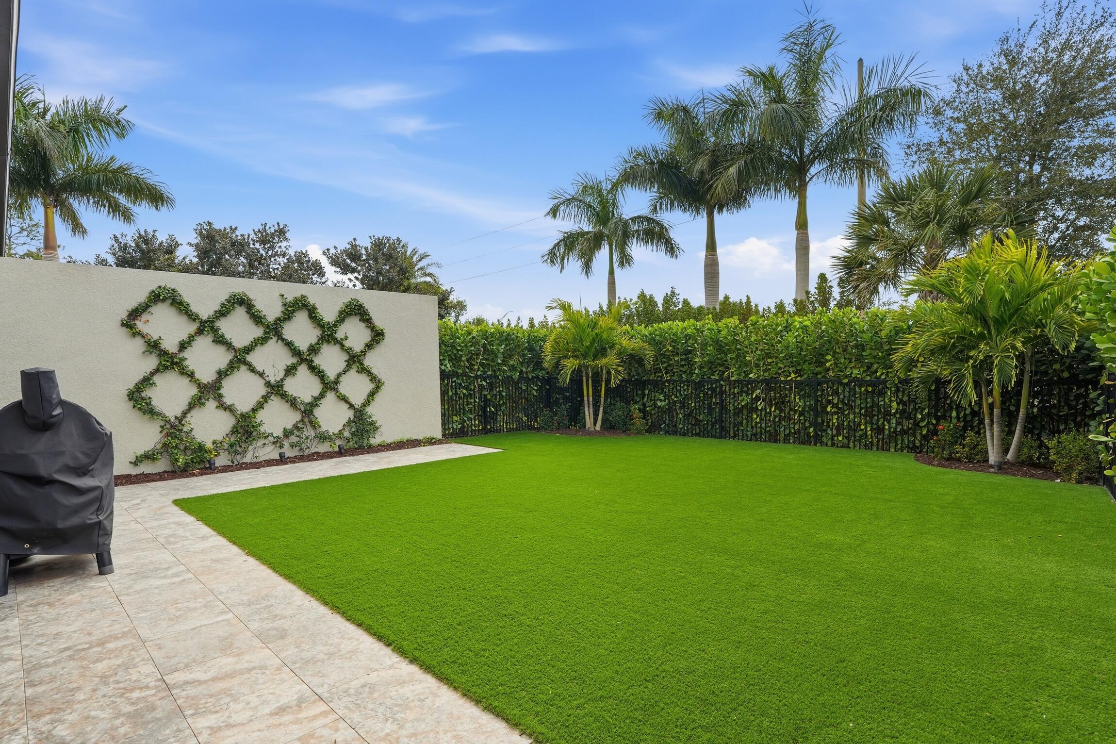 14708 Kingfisher Loop Naples, FL 34120 - Photo 33 of 42 a view of a backyard