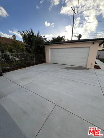 a bathroom with a shower sink mirror and toilet