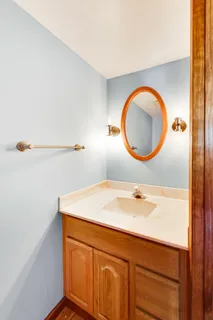 a bedroom with a bed and ceiling fan