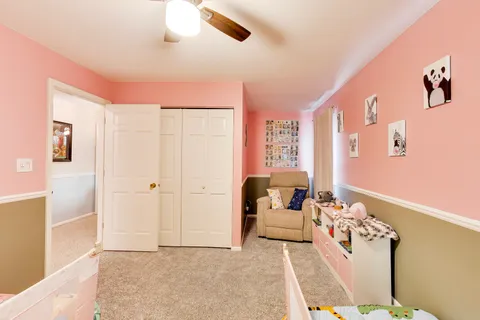 a bed room with a bed and a window