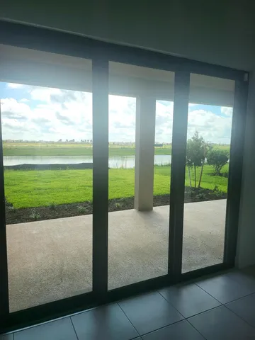 a view of a room with an outdoor seating space