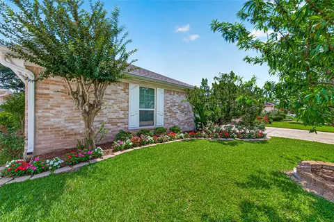 a view of a house with a garden