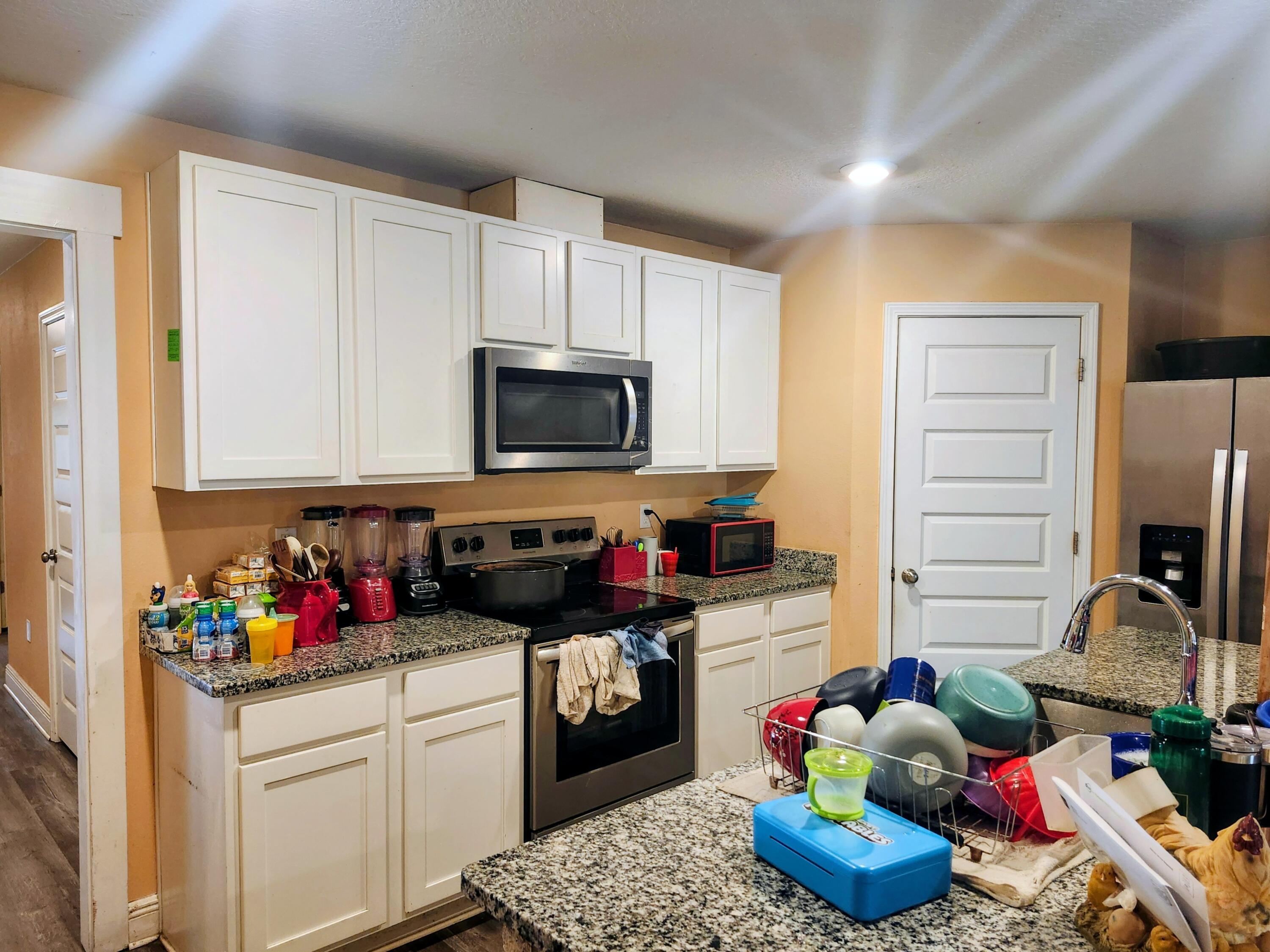 167 Apache Drive DeFuniak Springs, FL 32435 - Photo 16 of 18 a kitchen with a sink microwave and cabinets