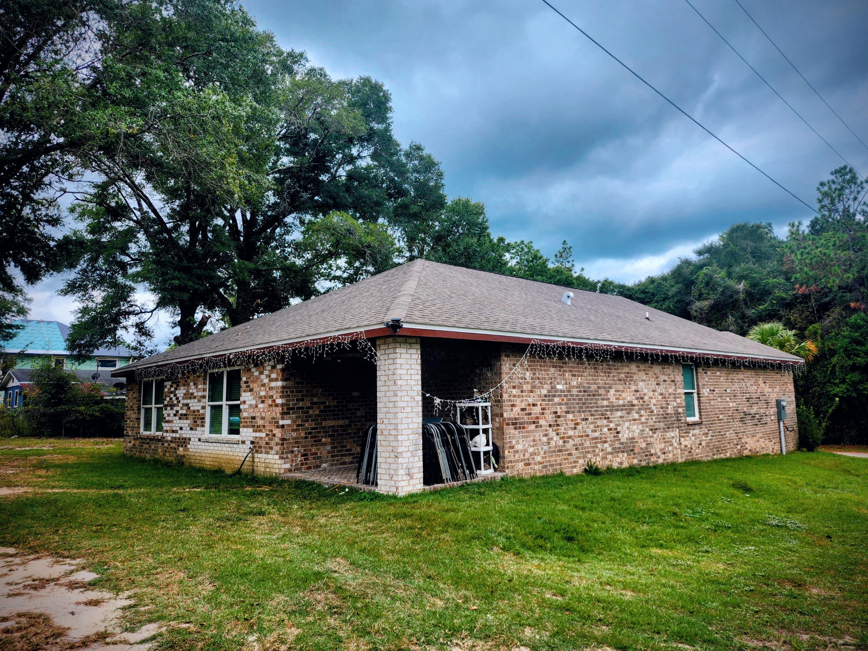 167 Apache Drive DeFuniak Springs, FL 32435 - Photo 2 of 18 a front view of a house with a garden