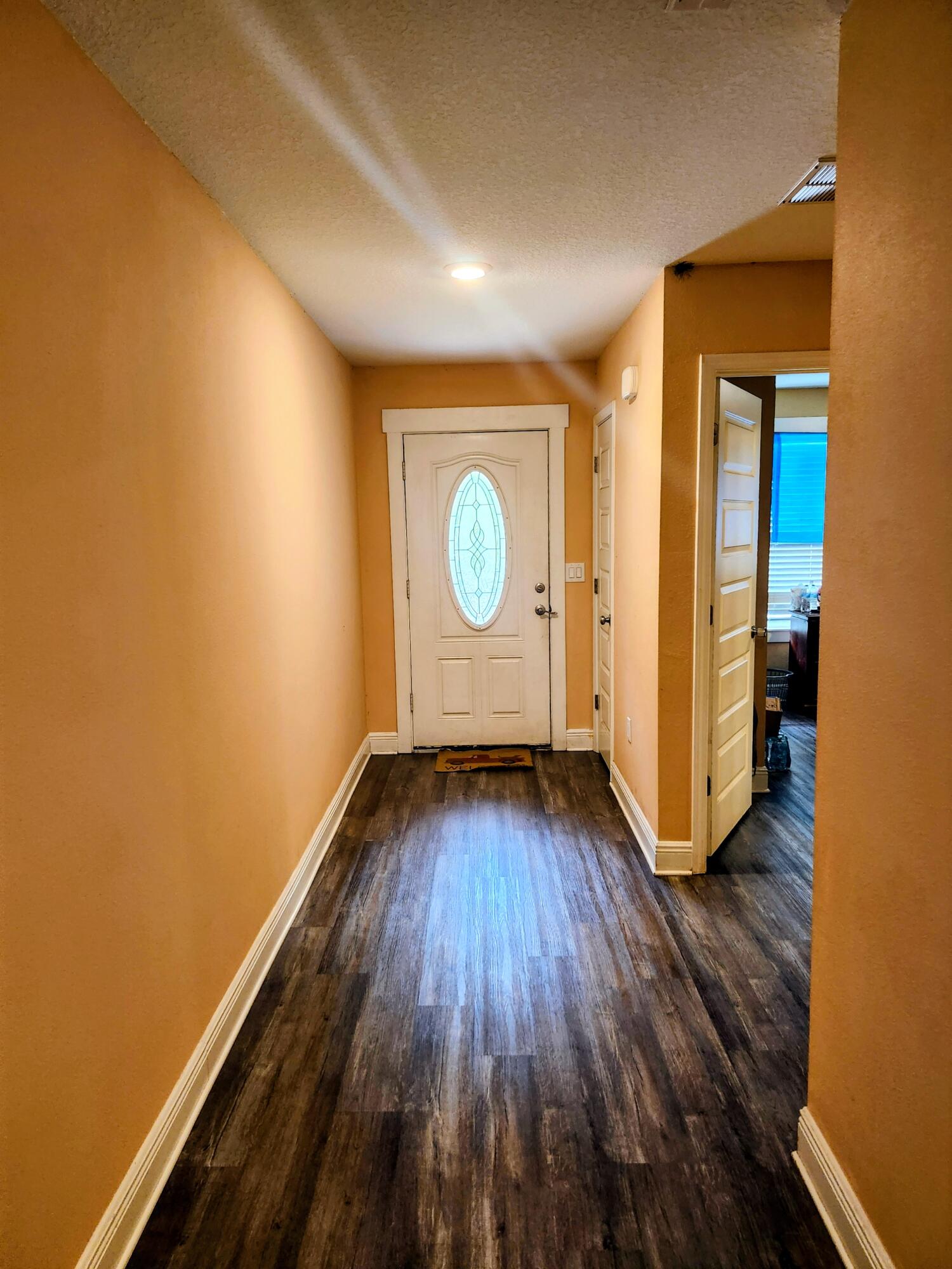 167 Apache Drive DeFuniak Springs, FL 32435 - Photo 3 of 18 a view of an empty room with wooden floor