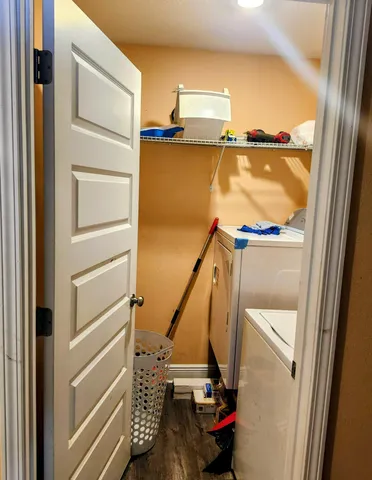 a view of walk in closet with empty racks