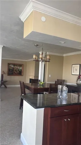 a kitchen with a counter space a sink and cabinets
