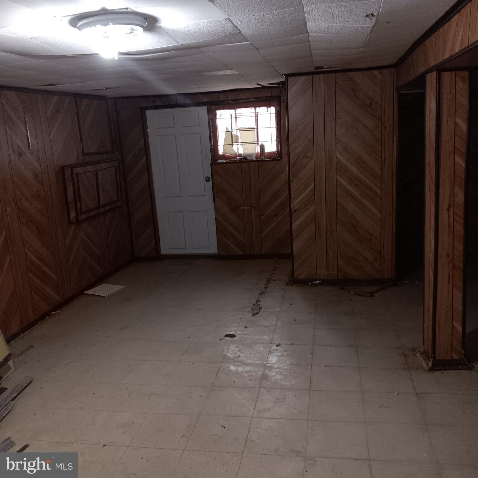 2419 Mosher Street Baltimore, MD 21216 - Photo 13 of 19 a view of an empty room with a window