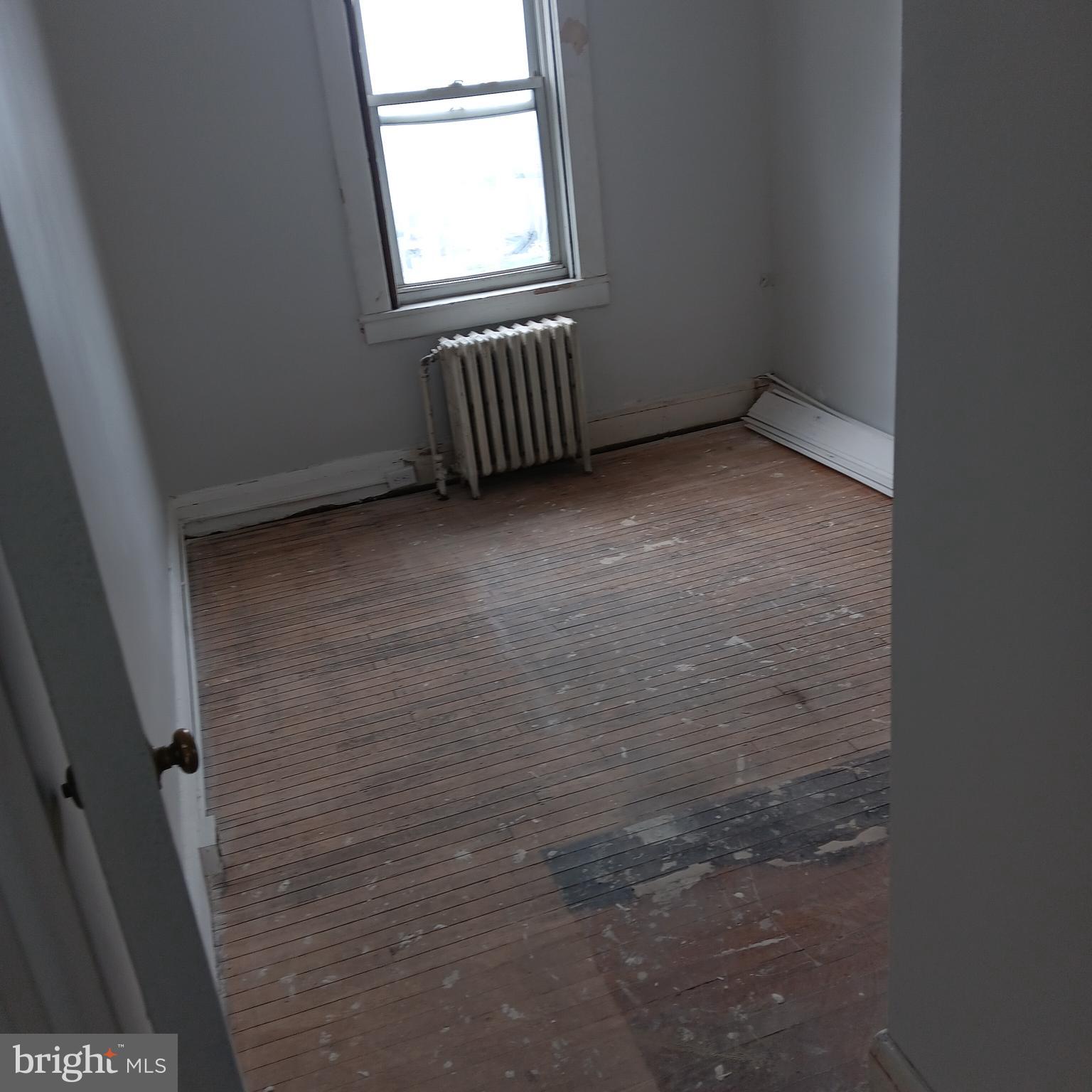 2419 Mosher Street Baltimore, MD 21216 - Photo 10 of 19 an empty room with windows