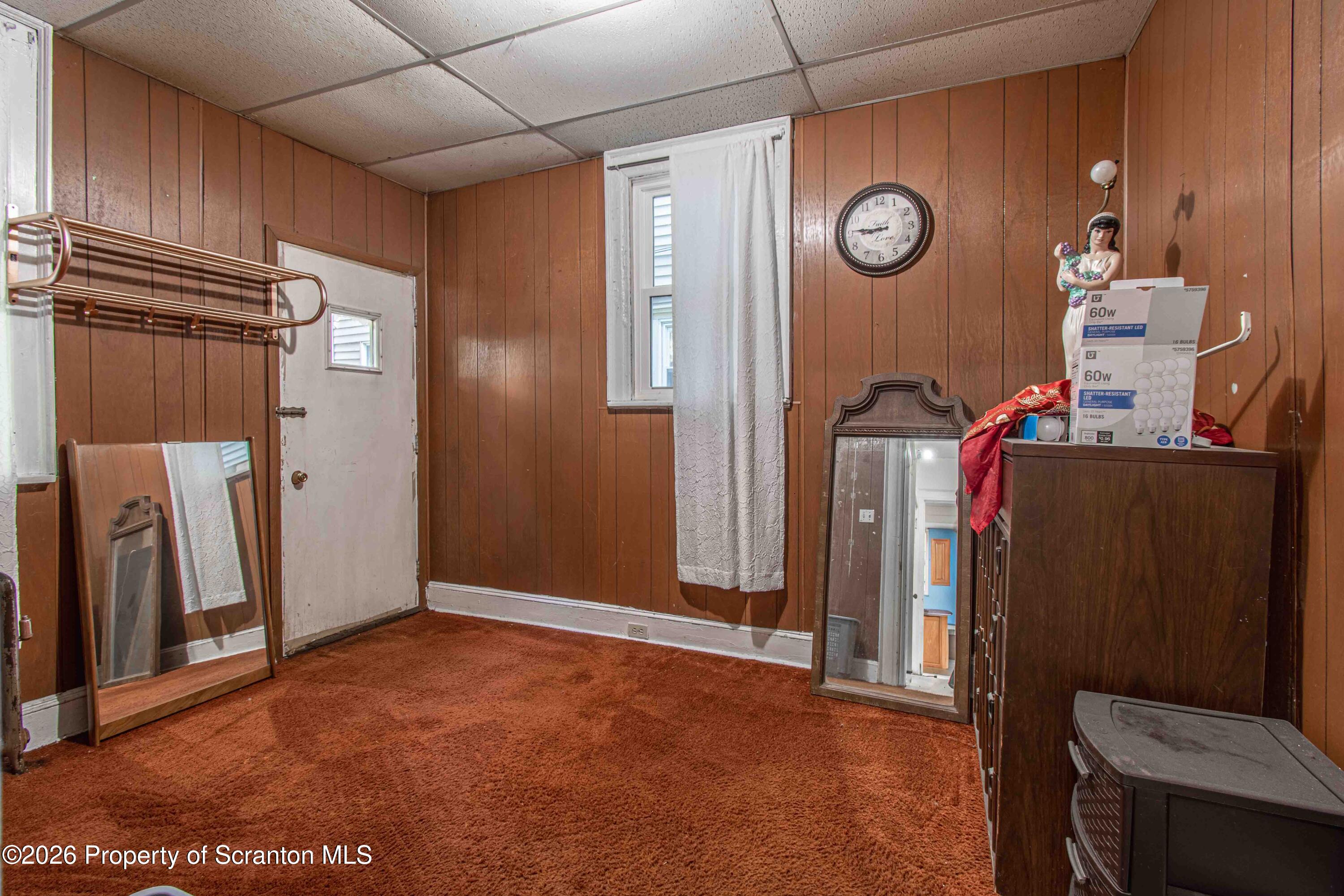 844 Monroe Avenue, Unit 844 Scranton, PA 18510 - Photo 11 of 15 a view of an empty room with wooden floor and a window