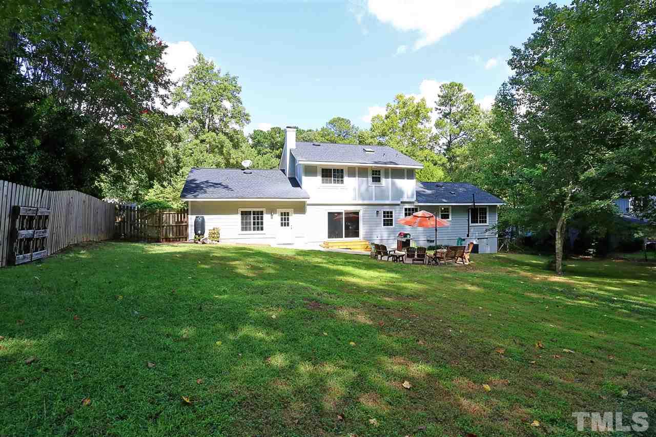 7101 Tanbark Way Raleigh, NC 27615 - Photo 23 of 25 a front view of house with yard and green space