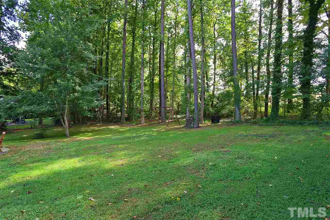 7101 Tanbark Way Raleigh, NC 27615 - Photo 24 of 25 a view of outdoor space with a garden
