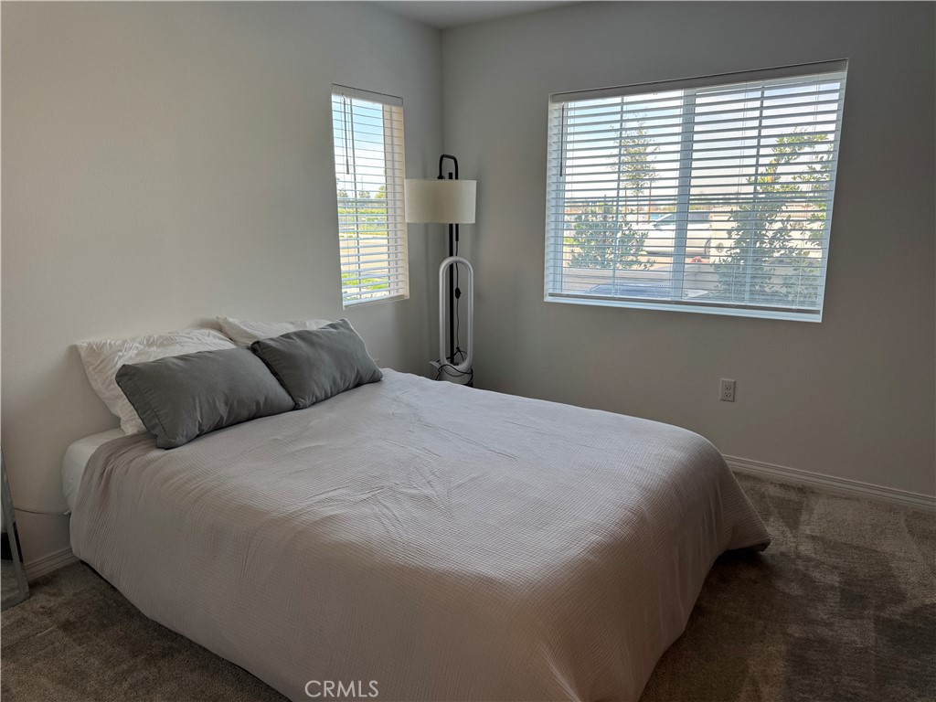 19167 Sequoia Grv Street Riverside, CA 92507 - Photo 13 of 30 a bedroom with a bed and window