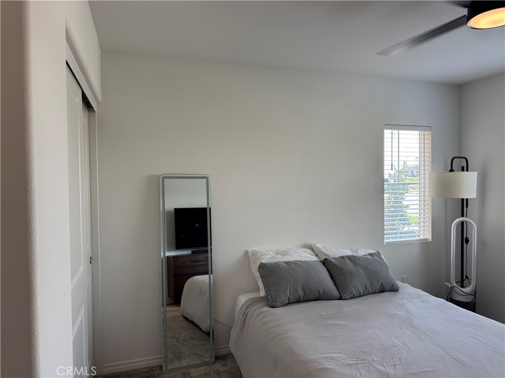 19167 Sequoia Grv Street Riverside, CA 92507 - Photo 14 of 30 a bedroom with a bed and window