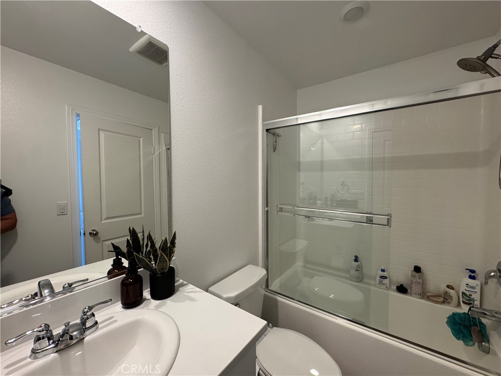 19167 Sequoia Grv Street Riverside, CA 92507 - Photo 18 of 30 a bathroom with a sink and a mirror