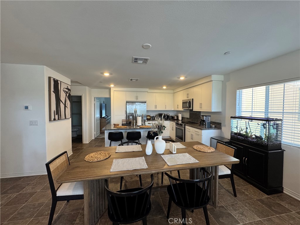 19167 Sequoia Grv Street Riverside, CA 92507 - Photo 24 of 30 a view of a dining room with furniture