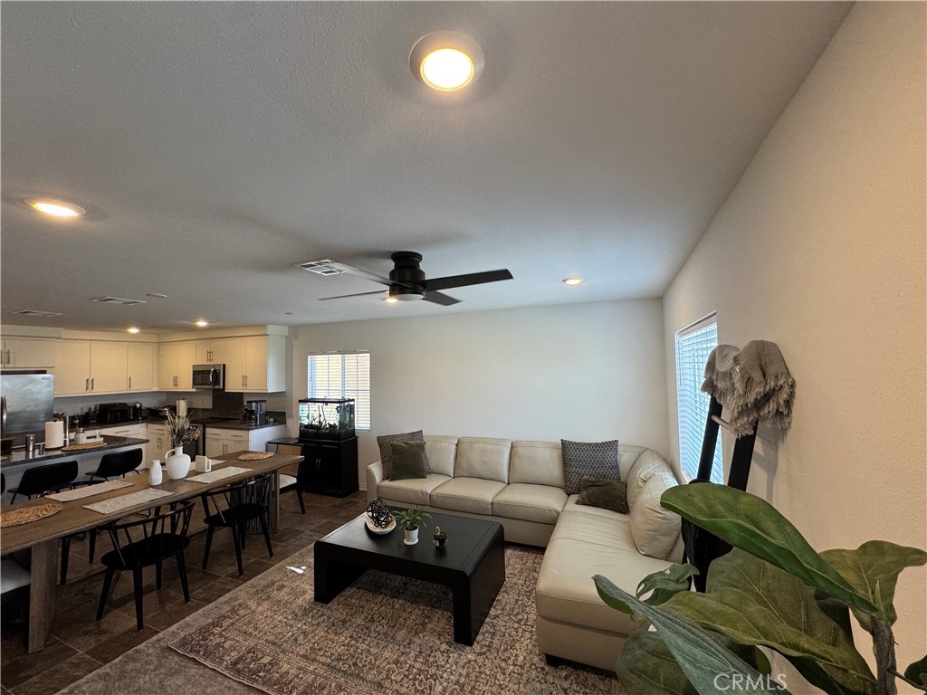 19167 Sequoia Grv Street Riverside, CA 92507 - Photo 25 of 30 a living room with furniture and a flat screen tv