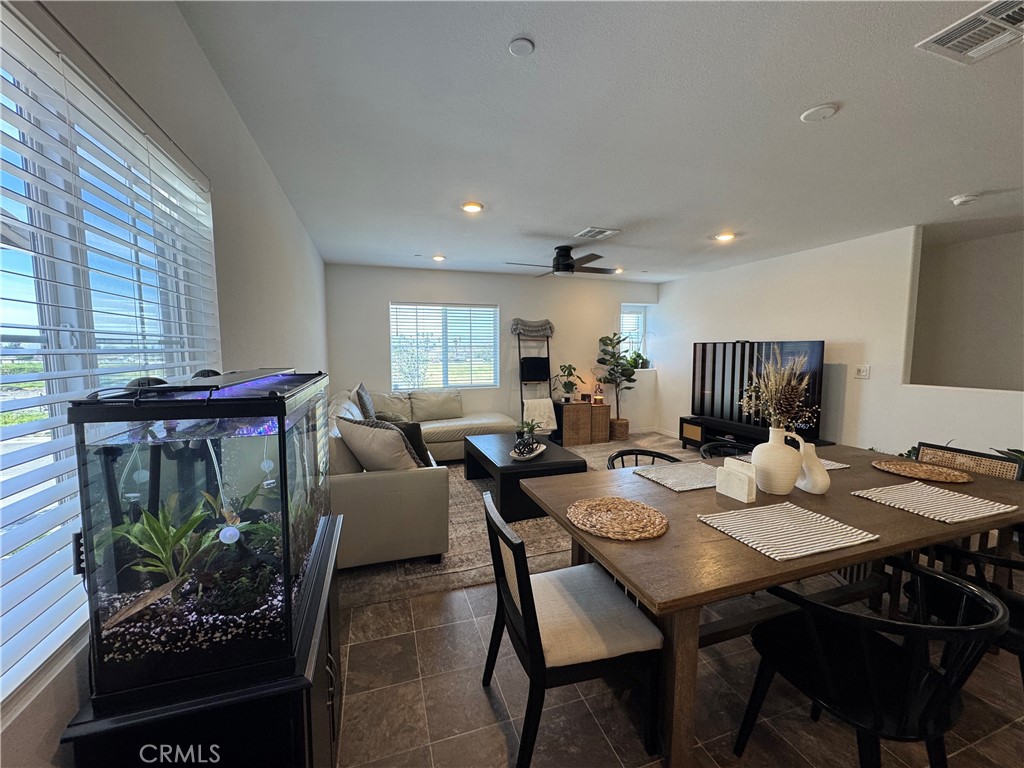 19167 Sequoia Grv Street Riverside, CA 92507 - Photo 26 of 30 a view of a dining room with furniture window and wooden floor