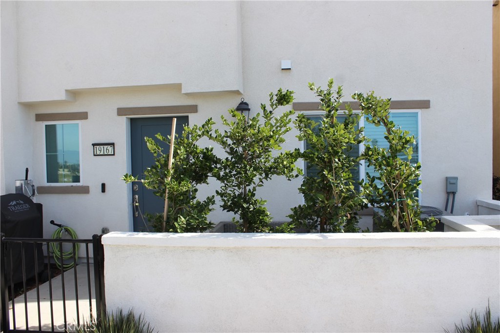 19167 Sequoia Grv Street Riverside, CA 92507 - Photo 4 of 30 a view of a house with a flower garden