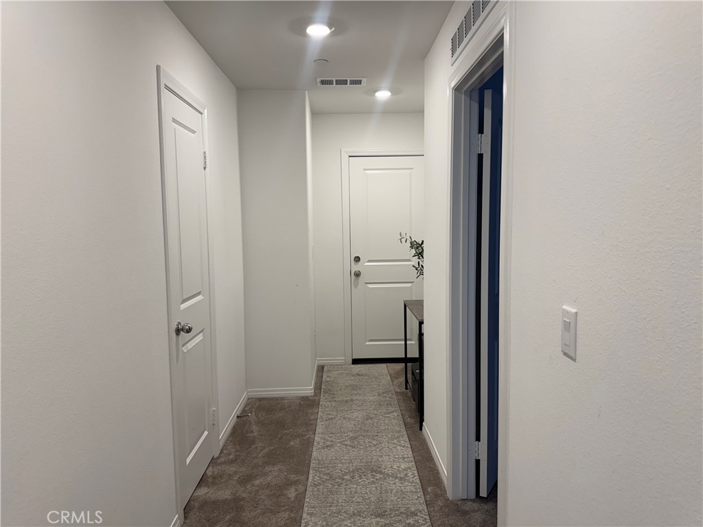 19167 Sequoia Grv Street Riverside, CA 92507 - Photo 6 of 30 a view of a bathroom from a hallway
