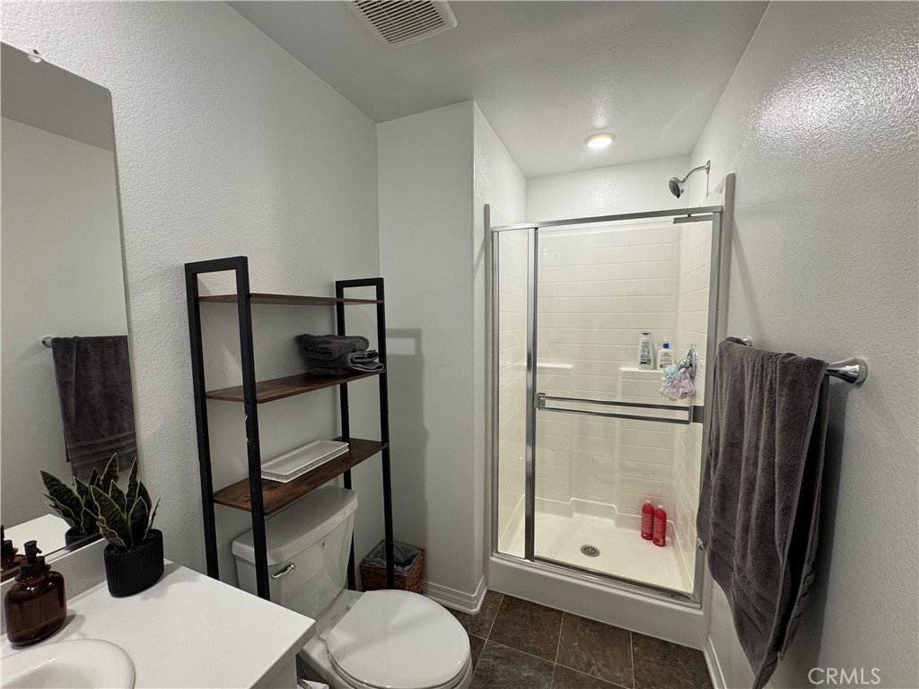 19167 Sequoia Grv Street Riverside, CA 92507 - Photo 10 of 30 a bathroom with a sink toilet and shower