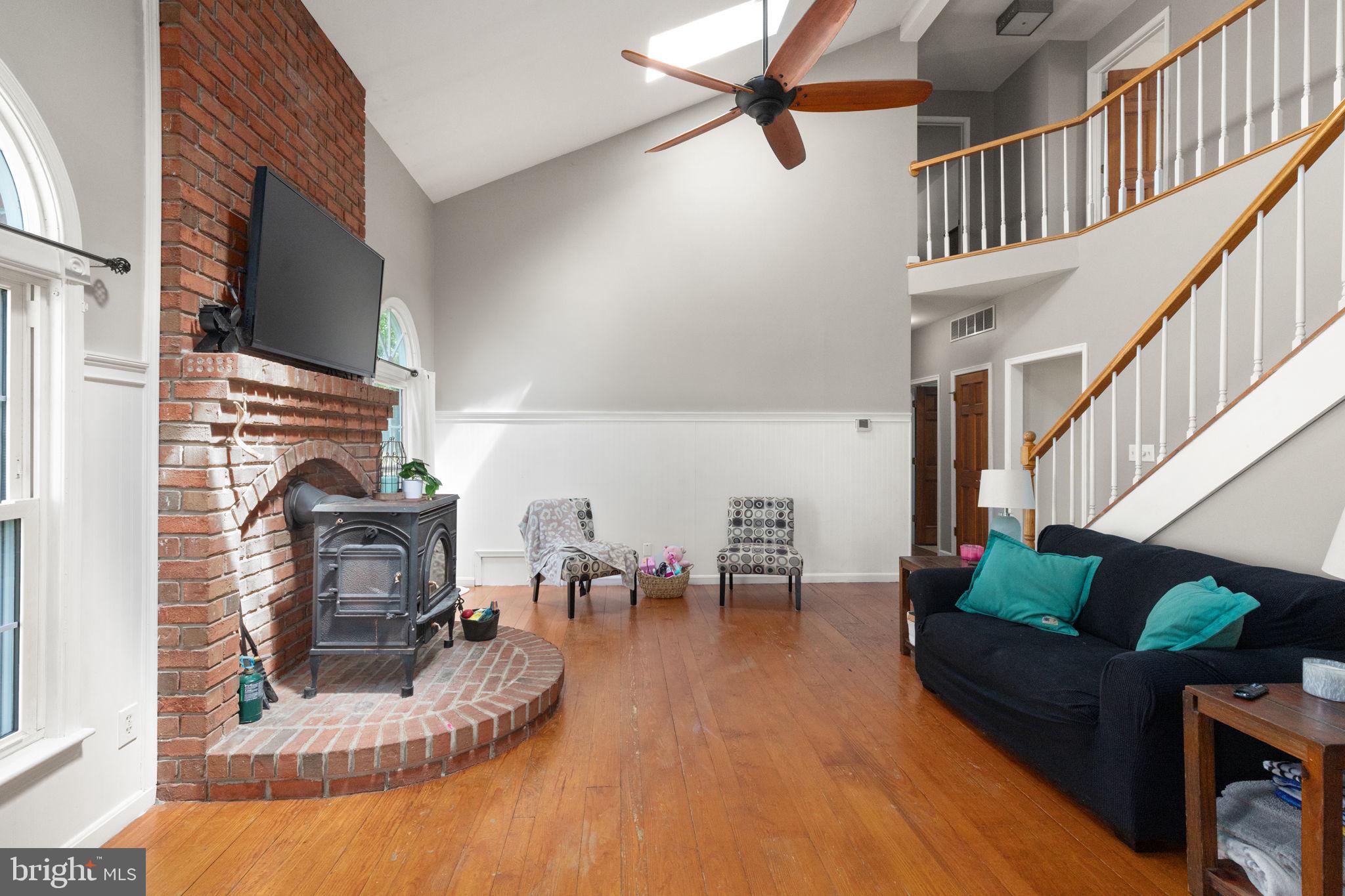 2140 Marston Road New Windsor, MD 21776 - Photo 9 of 48 a living room with furniture fireplace and a flat screen tv