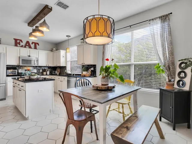 a view of a dining room with furniture