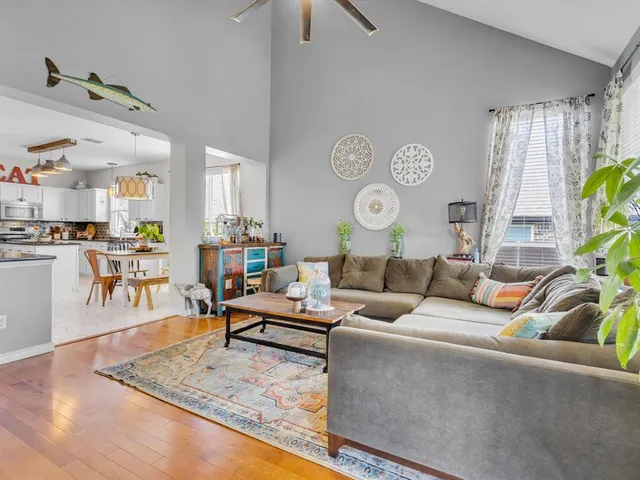 a living room with fireplace furniture and a flat screen tv
