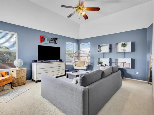 a bedroom with furniture and a window