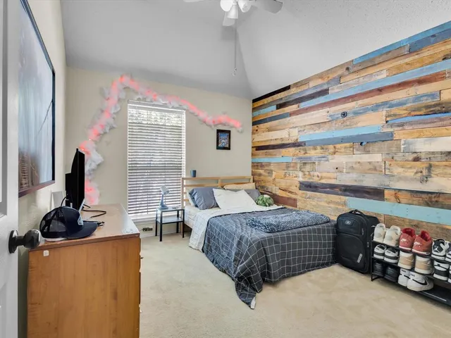 a bedroom with a bed furniture and a window