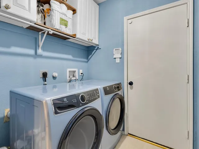a front view of a house with a garden and deck