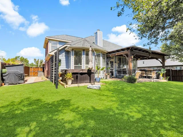 a view of an chairs and table in the patio