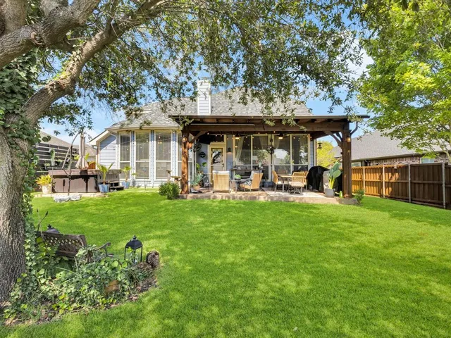 an aerial view of a house with a swimming pool