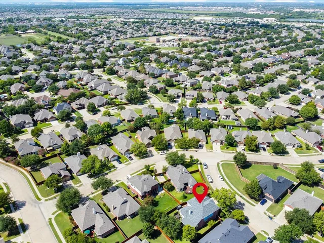 a view of a house with a yard and garage