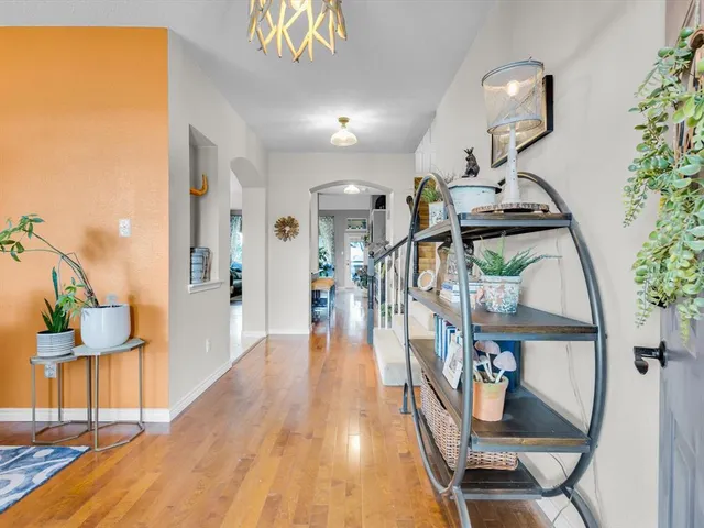 a view of a dining room with furniture and a chandelier