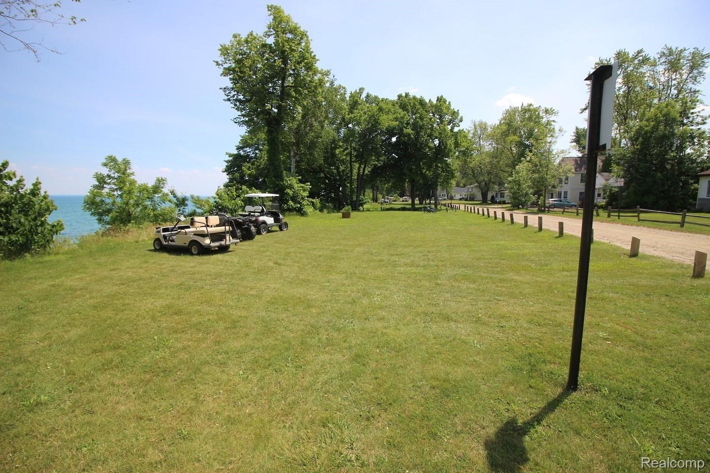 7381 Walbridge Road Lexington, MI 48450 - Photo 10 of 31 w-grass by lake.jpg
