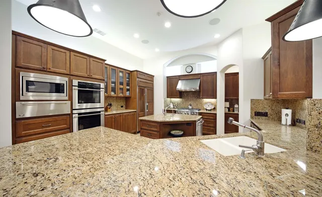 a living room with furniture and large window