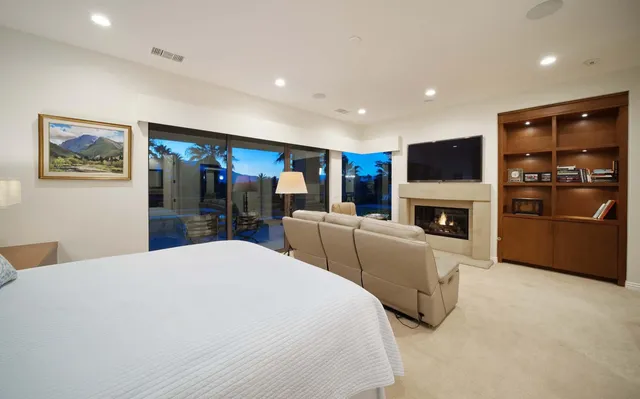 a bedroom with furniture and a window