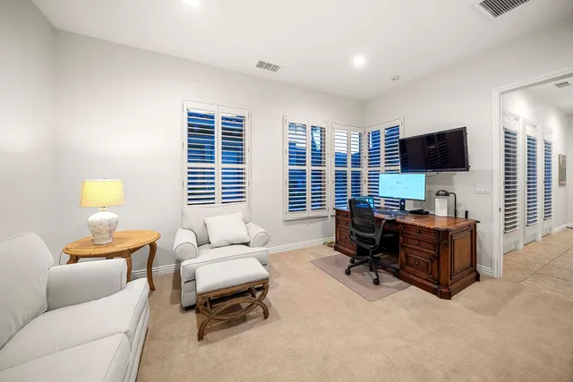 a view of a backyard with sitting area