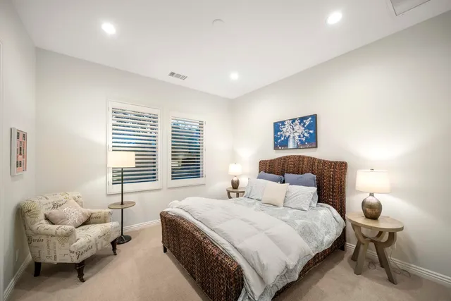 a view of a house with swimming pool and sitting area