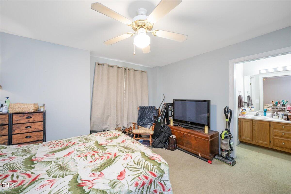604 Sinewell Drive Wake Forest, NC 27587 - Photo 13 of 25 a bedroom with a bed and furniture
